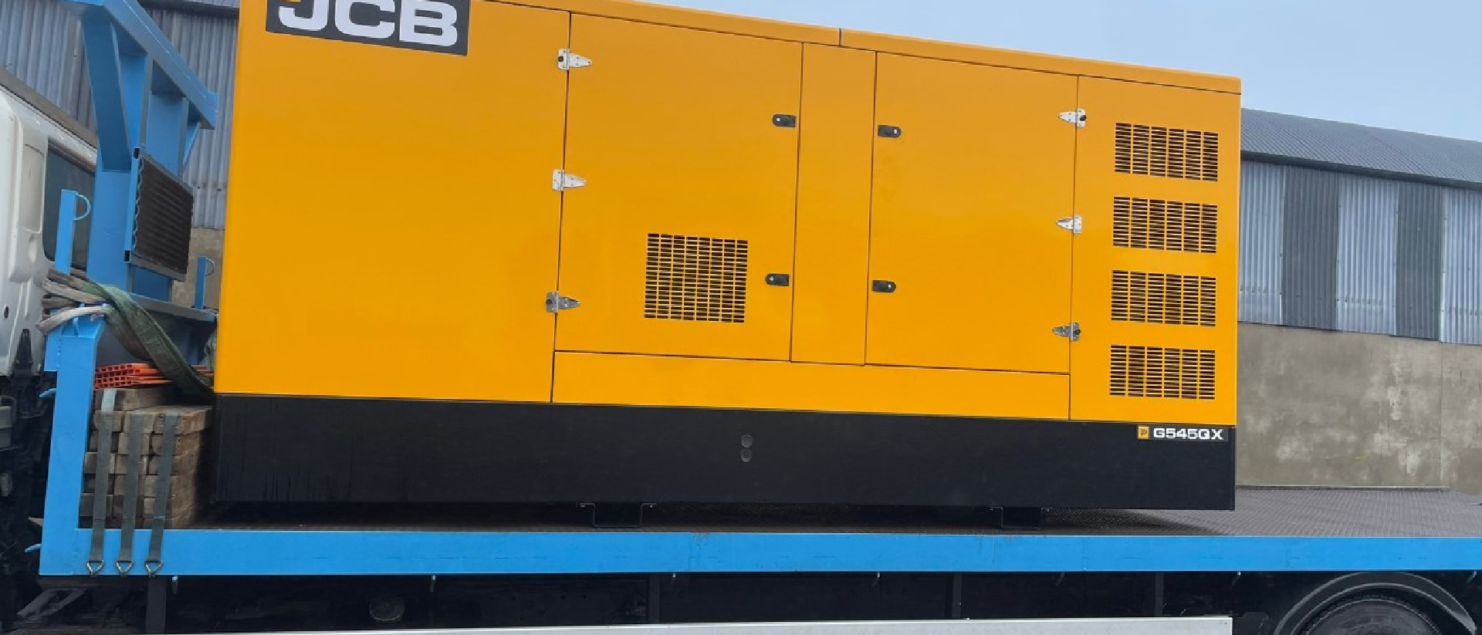JCB G545QX Generator loaded on a truck ready for delivery