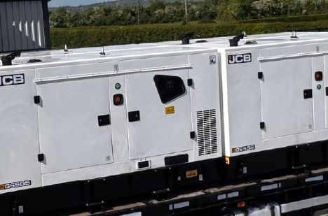 four JCB generators loaded on truck