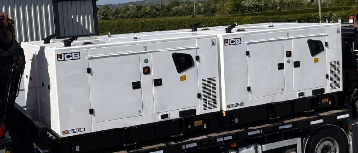 four JCB generators loaded on truck